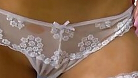 Ponytailed brunette fishnet stocking masturbation