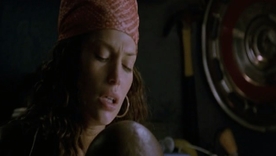 Jolene Blalock's revealing bed scene with a brunette man