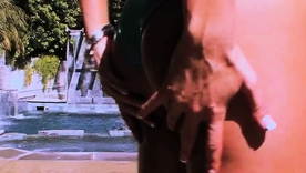 Sexy brunette in a bikini masturbating outdoors