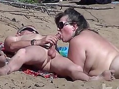 Blowjob on a nudist beach