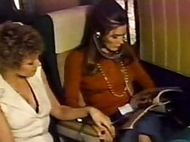 Mature is licking a young girl on a airline