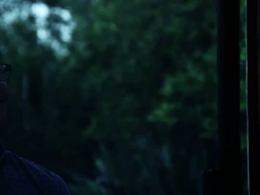 Jessie Andrews beside a hardcore threesome with two muscular men