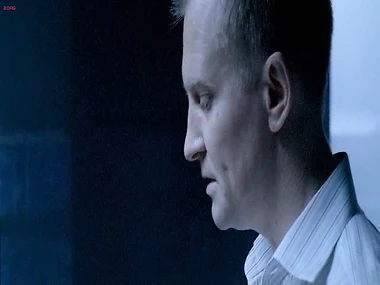 Olga Kurylenko in a vulnerable position, suspended invert and bare while at one employs a