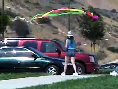 Blonde teen April pleases herself with a popsicle outdoors