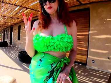 Red XXX, a curvy redhead MILF, indulges in solo turn by the pool