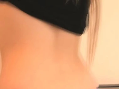 Megan Sweets, a stunning blonde, seductively sheds her black and pink threads on camera.