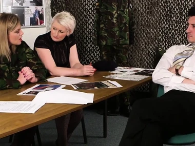 Holly Kiss, blonde femdom, gives handjob to soldier in training